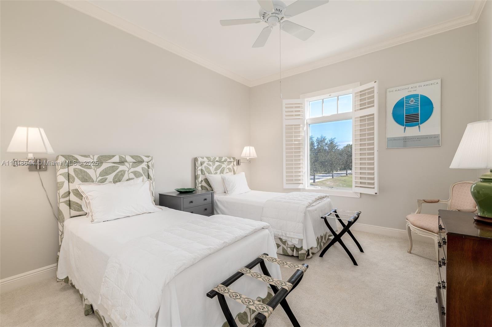 11609 Southeast Florida Avenue Hobe Sound, FL 33455 - Photo 25 of 31 a bedroom with two beds and a table