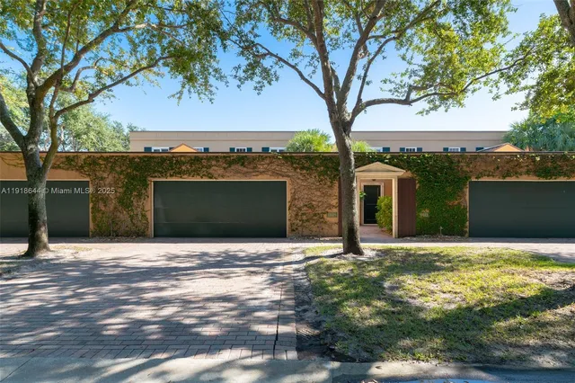 a house with trees in the background