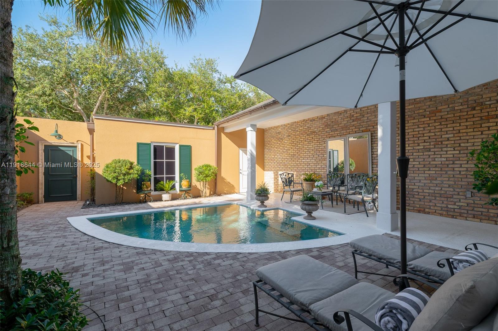 11609 Southeast Florida Avenue Hobe Sound, FL 33455 - Photo 7 of 31 a outdoor space with patio
