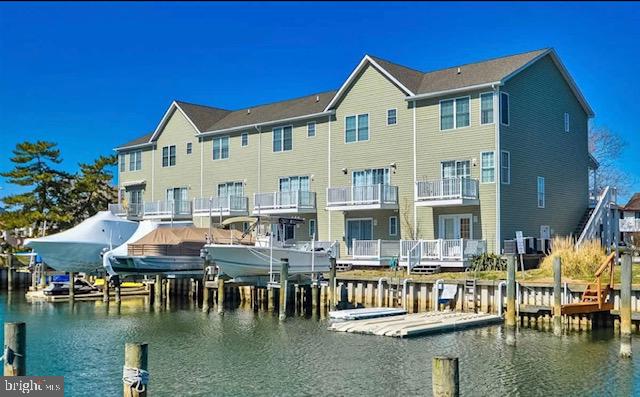 617 Salt Spray Road, Unit B Ocean City, MD 21842 - Photo 3 of 72 a view of house with swimming pool yard outdoor seating and living room