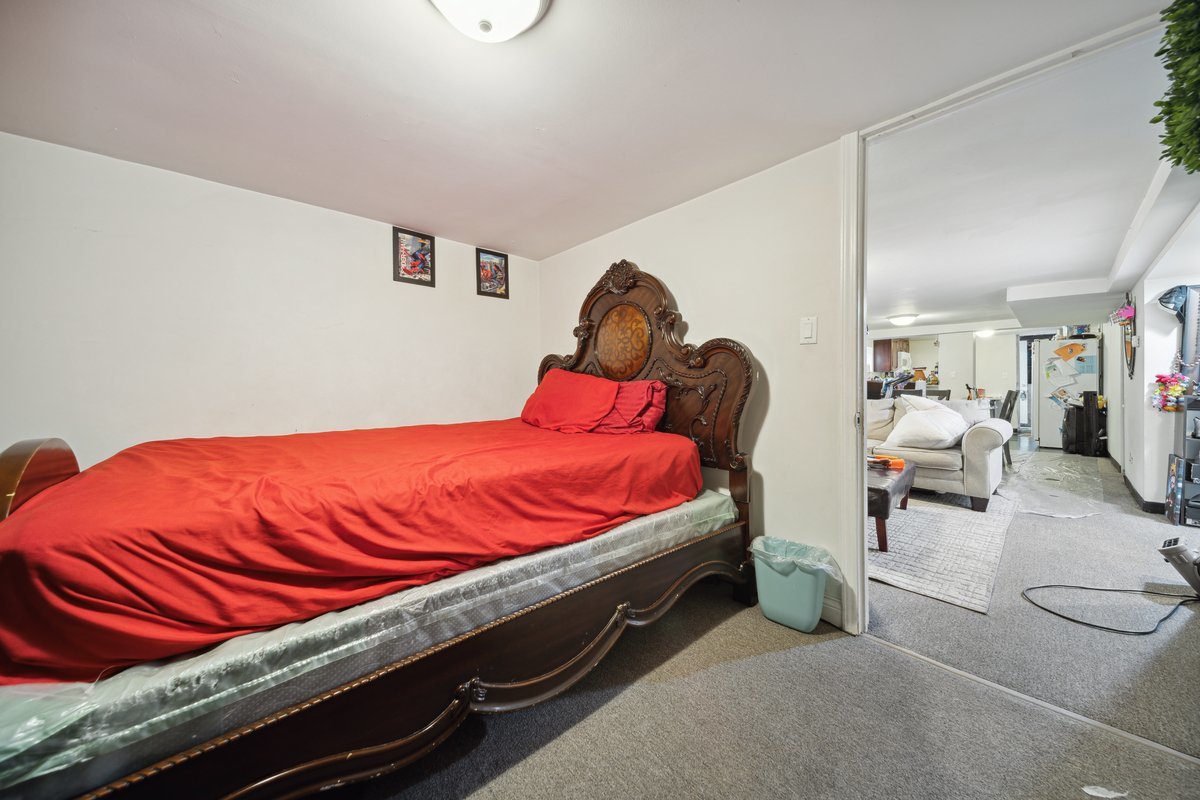4703 West Parker Avenue Chicago, IL 60639 - Photo 20 of 27 a bed sitting in a bedroom next to a window