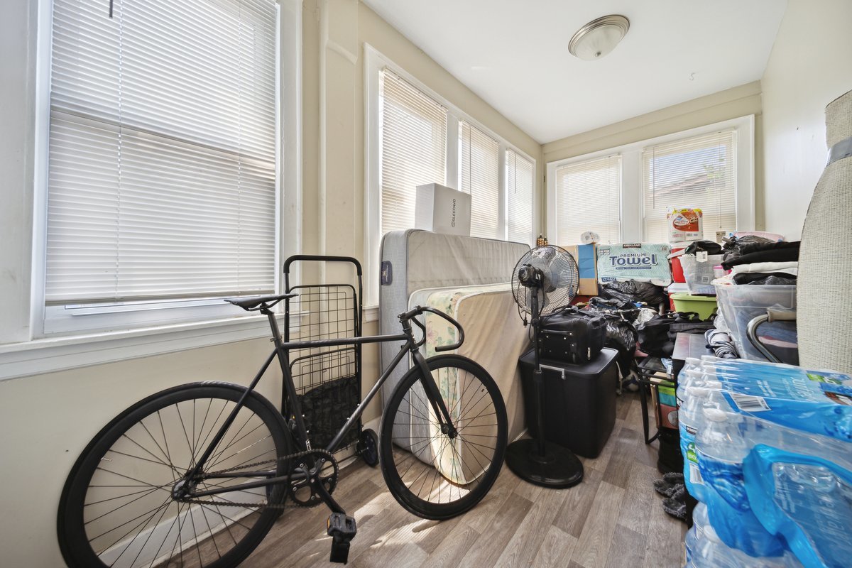 4703 West Parker Avenue Chicago, IL 60639 - Photo 22 of 27 a view of a workspace with furniture and a window