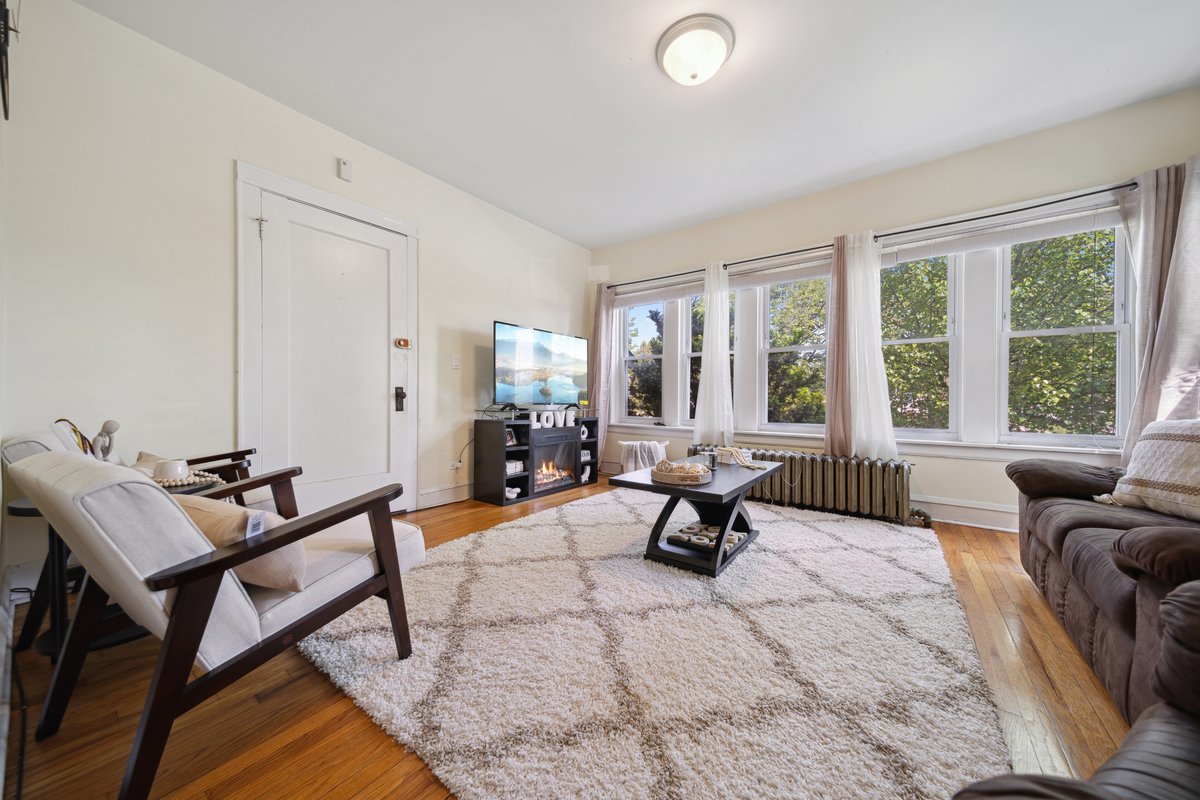 4703 West Parker Avenue Chicago, IL 60639 - Photo 3 of 27 a living room with furniture and a large window