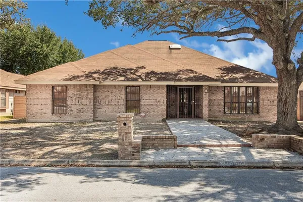 a front view of a house with yard