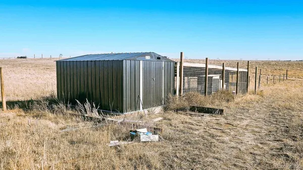 a backyard of a house with large trees