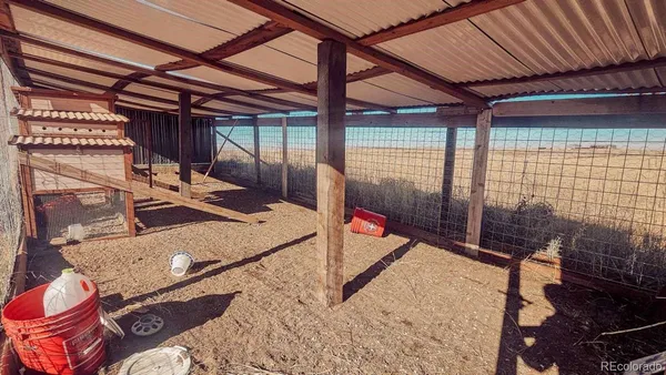 a view of a chairs and table in the patio