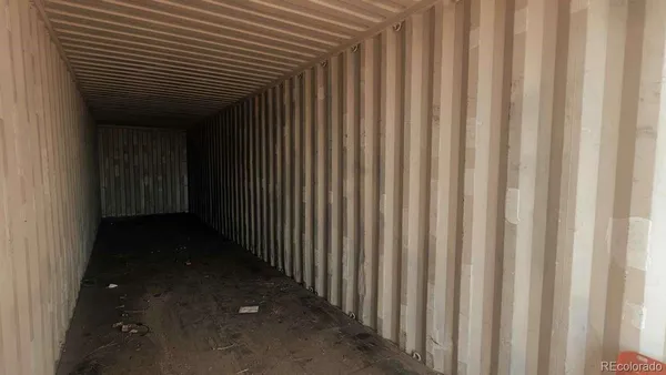 a view of a porch with a wooden door