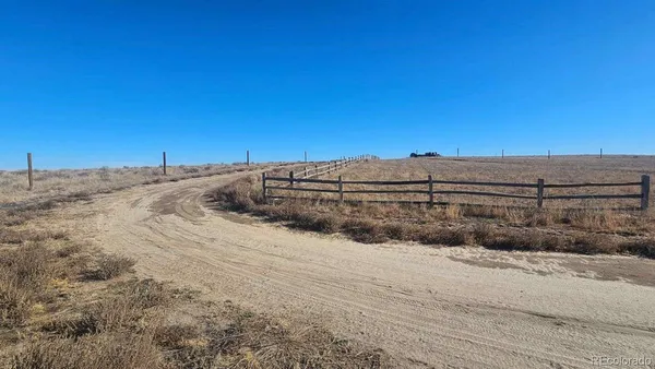 a view of a road with a building in the background