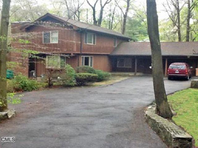 121 Red Fox Road Stamford, CT 06903 - Photo 1 of 1 a front view of a house with a yard and garage