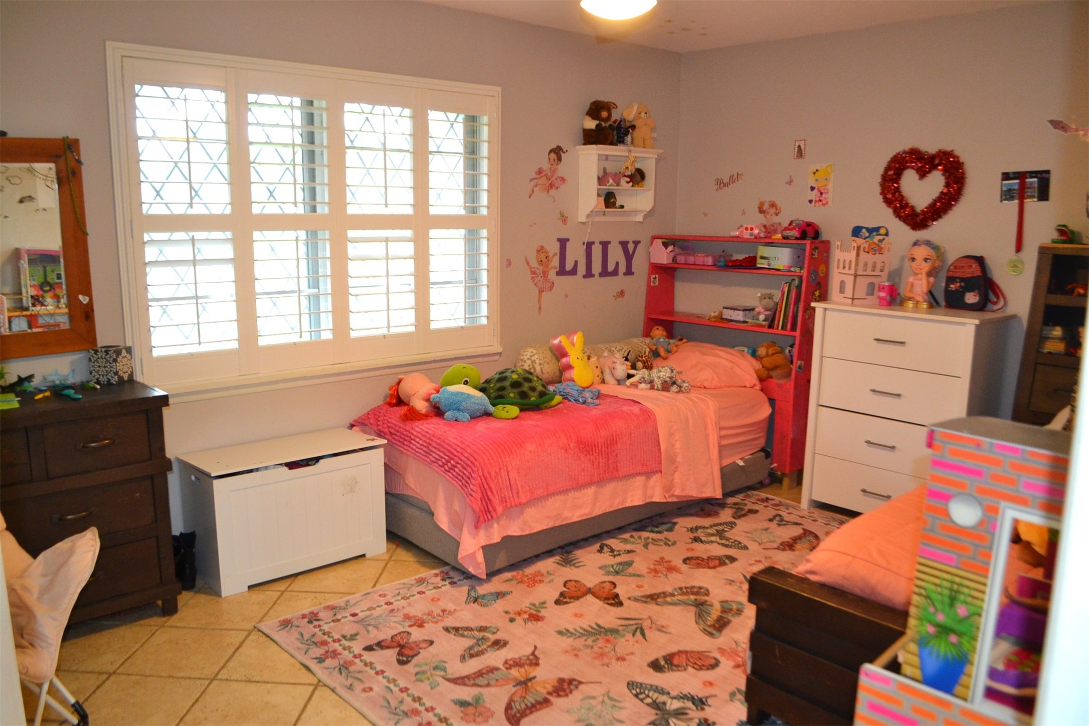 610 East X Street Deer Park, TX 77536 - Photo 34 of 44 a bedroom with a bed and window