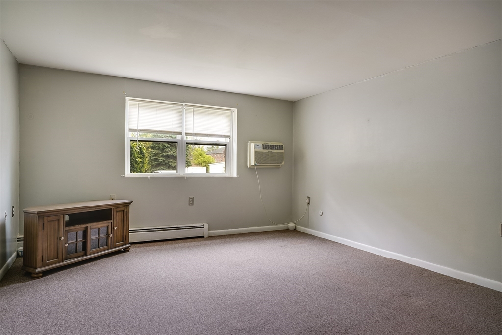 11 Cross Street, Unit 3 Chelmsford, MA 01863 - Photo 6 of 13 an empty room with windows