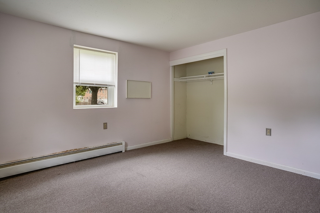 11 Cross Street, Unit 3 Chelmsford, MA 01863 - Photo 7 of 13 an empty room with a window