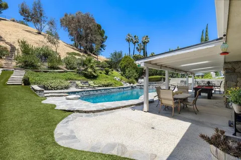 an aerial view of residential houses and outdoor space
