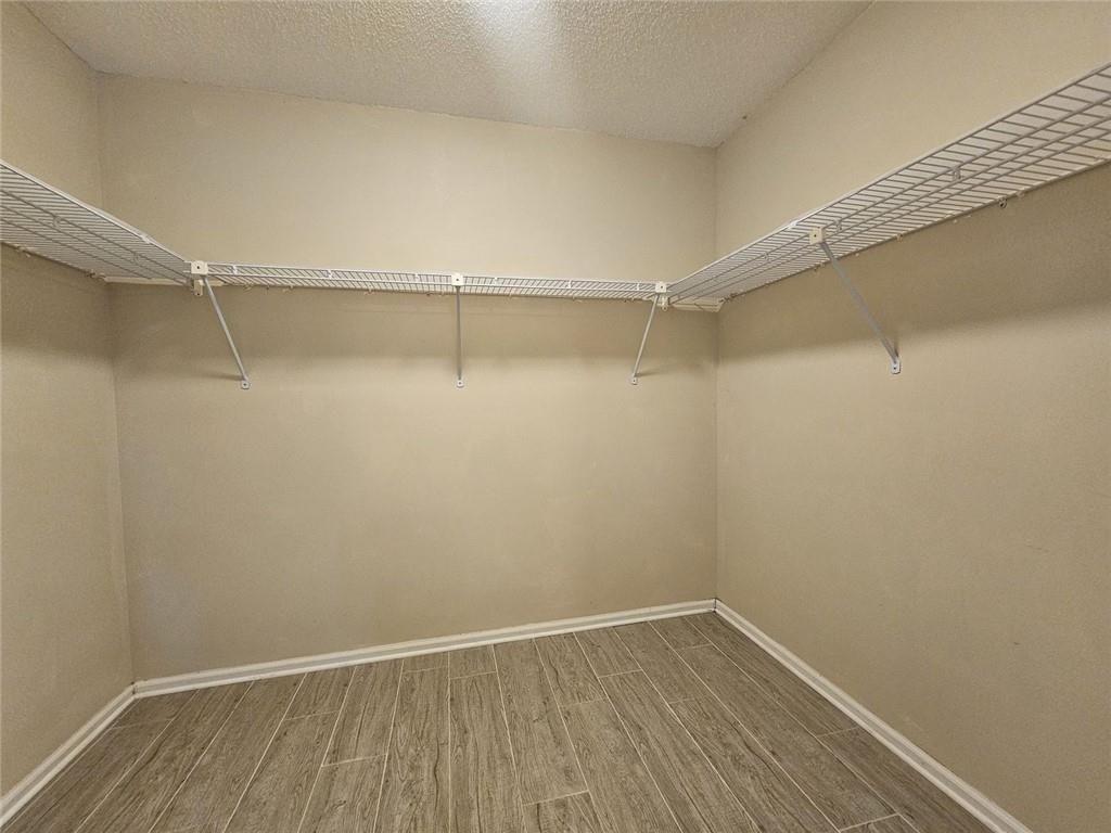 290 Oakmere Road Alpharetta, GA 30009 - Photo 15 of 26 a view of an empty walk in closet