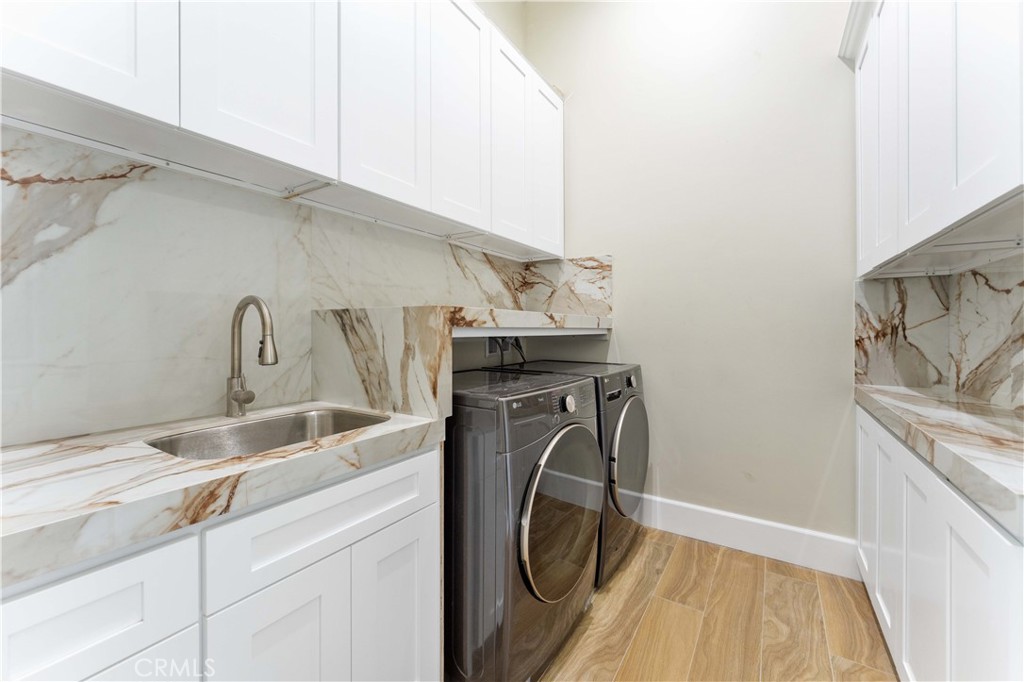 6338 Echo Mountain Rancho Cucamonga, CA 91739 - Photo 12 of 23 a utility room with dryer and washer