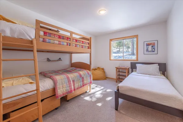 a bedroom with bed and a window