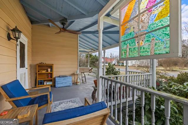 a view of front door and porch with couch