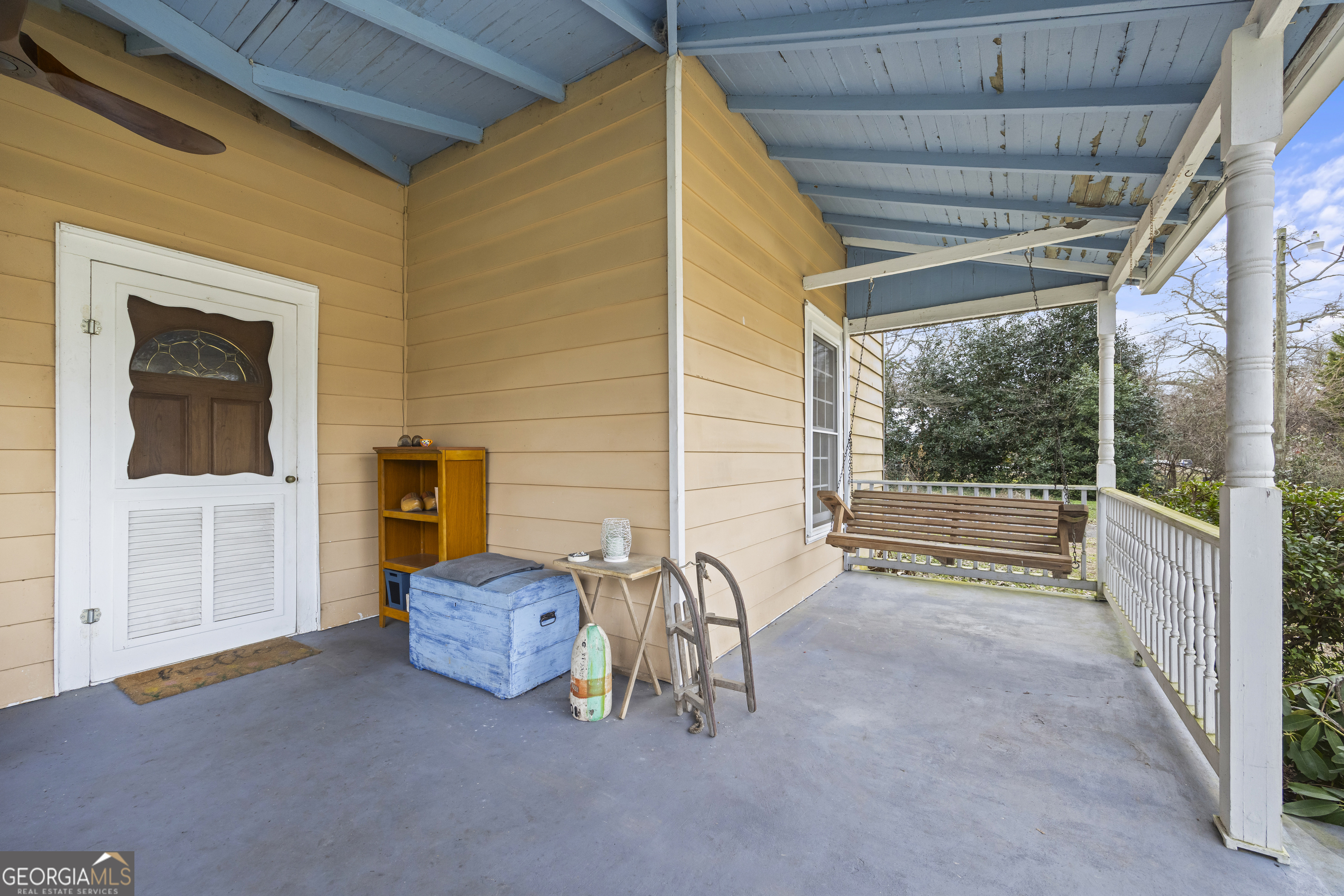 48 Georgia Avenue Comer, GA 30629 - Photo 14 of 46 a view of front door and porch with couch