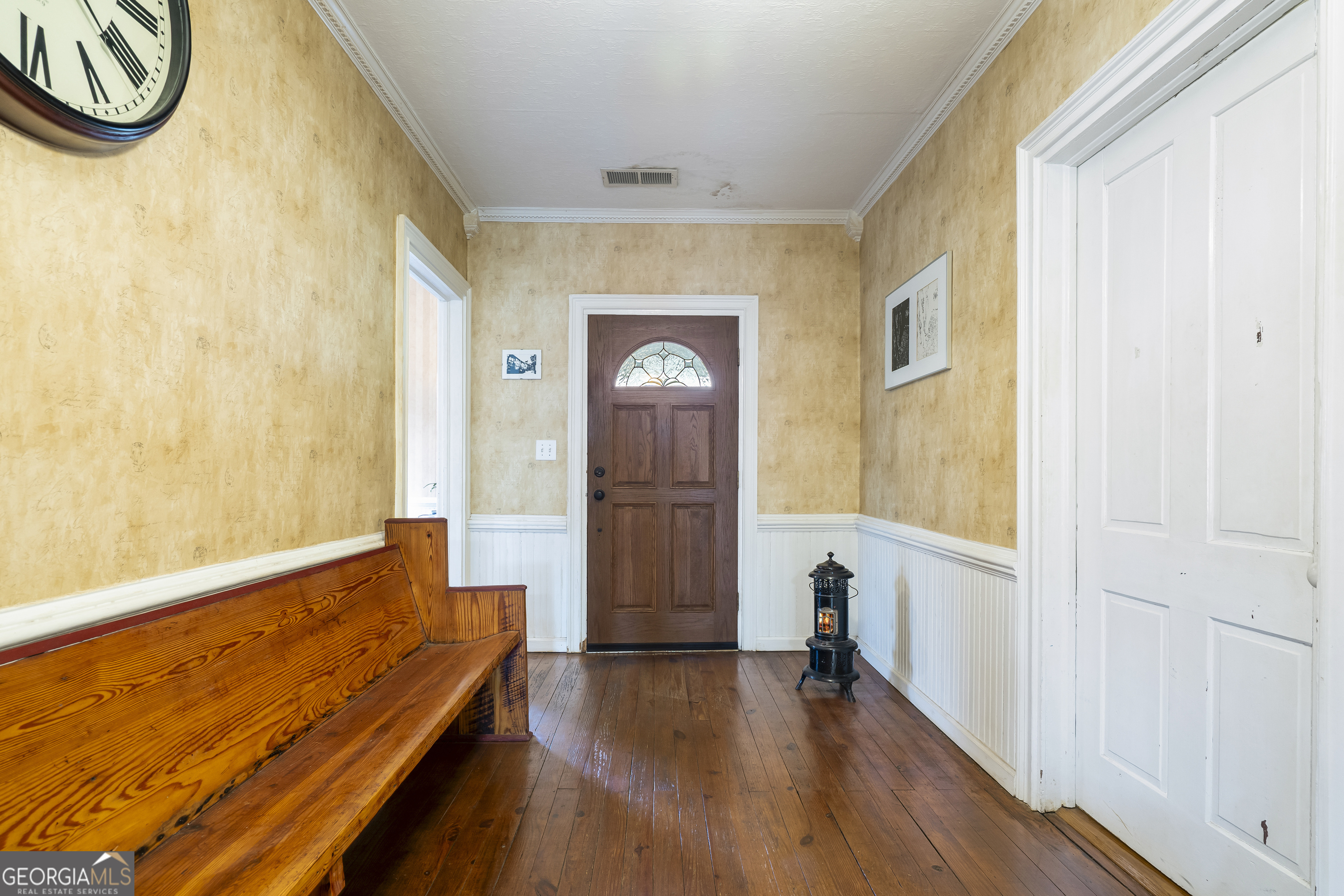 48 Georgia Avenue Comer, GA 30629 - Photo 18 of 46 a view of a hallway with wooden floor and a bathroom view