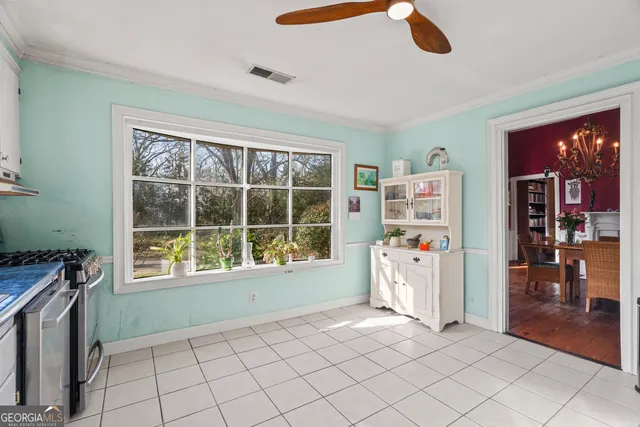 a open kitchen with granite countertop a sink window and stainless steel appliances