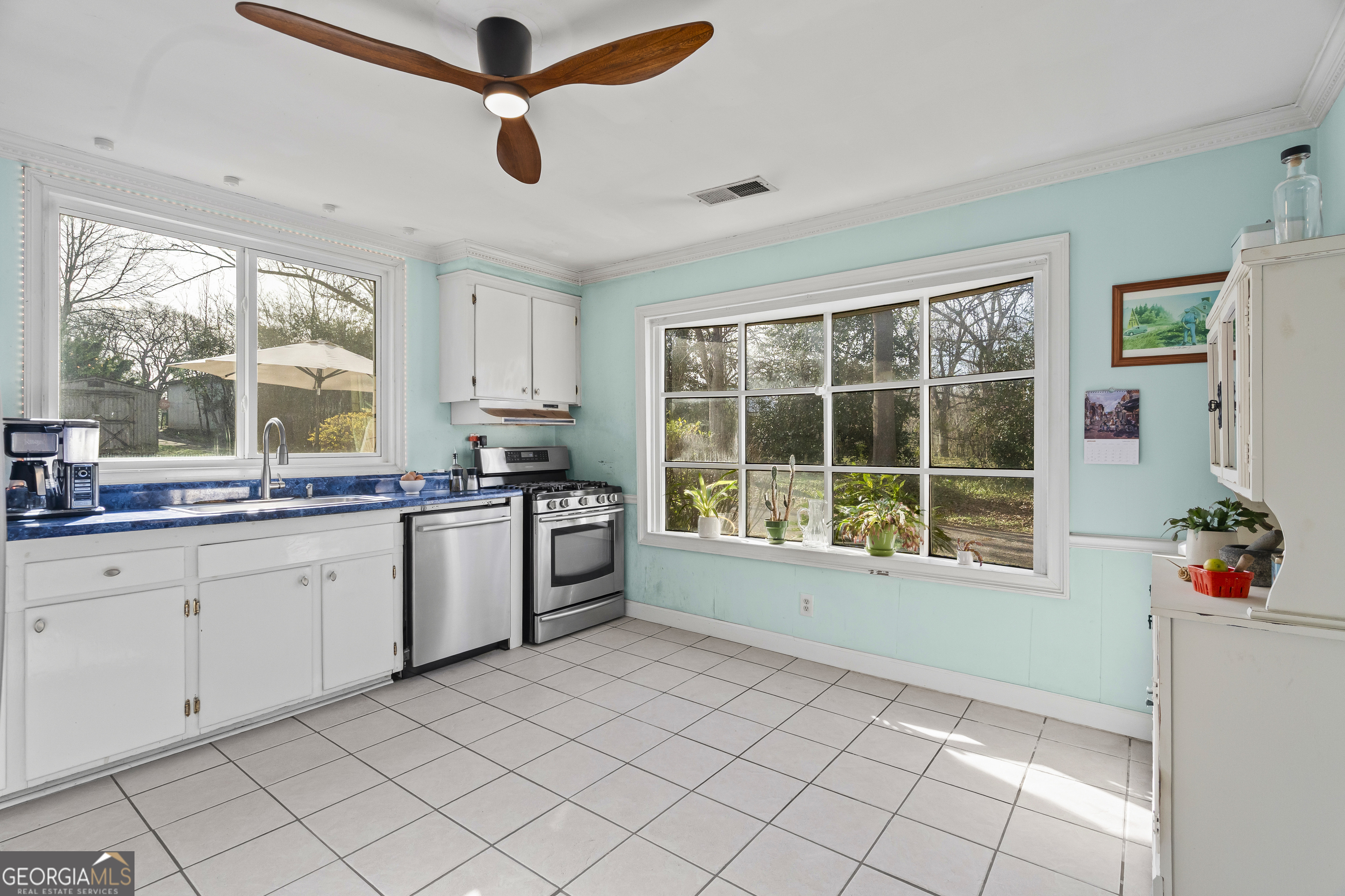48 Georgia Avenue Comer, GA 30629 - Photo 25 of 46 a open kitchen with granite countertop a sink window and stainless steel appliances