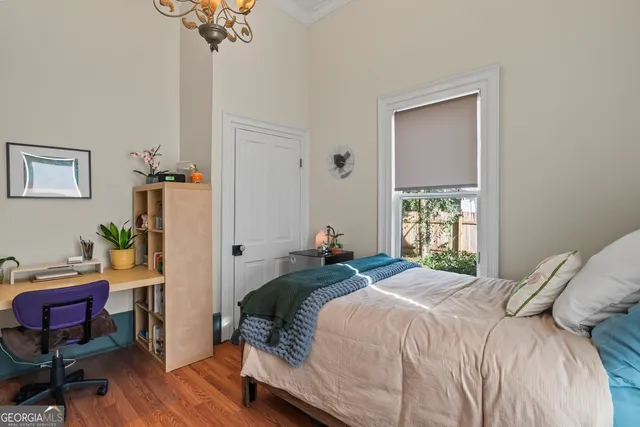 a bedroom with a bed and a couch