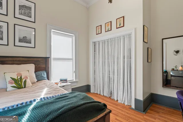 a bathroom with a sink mirror and a shower