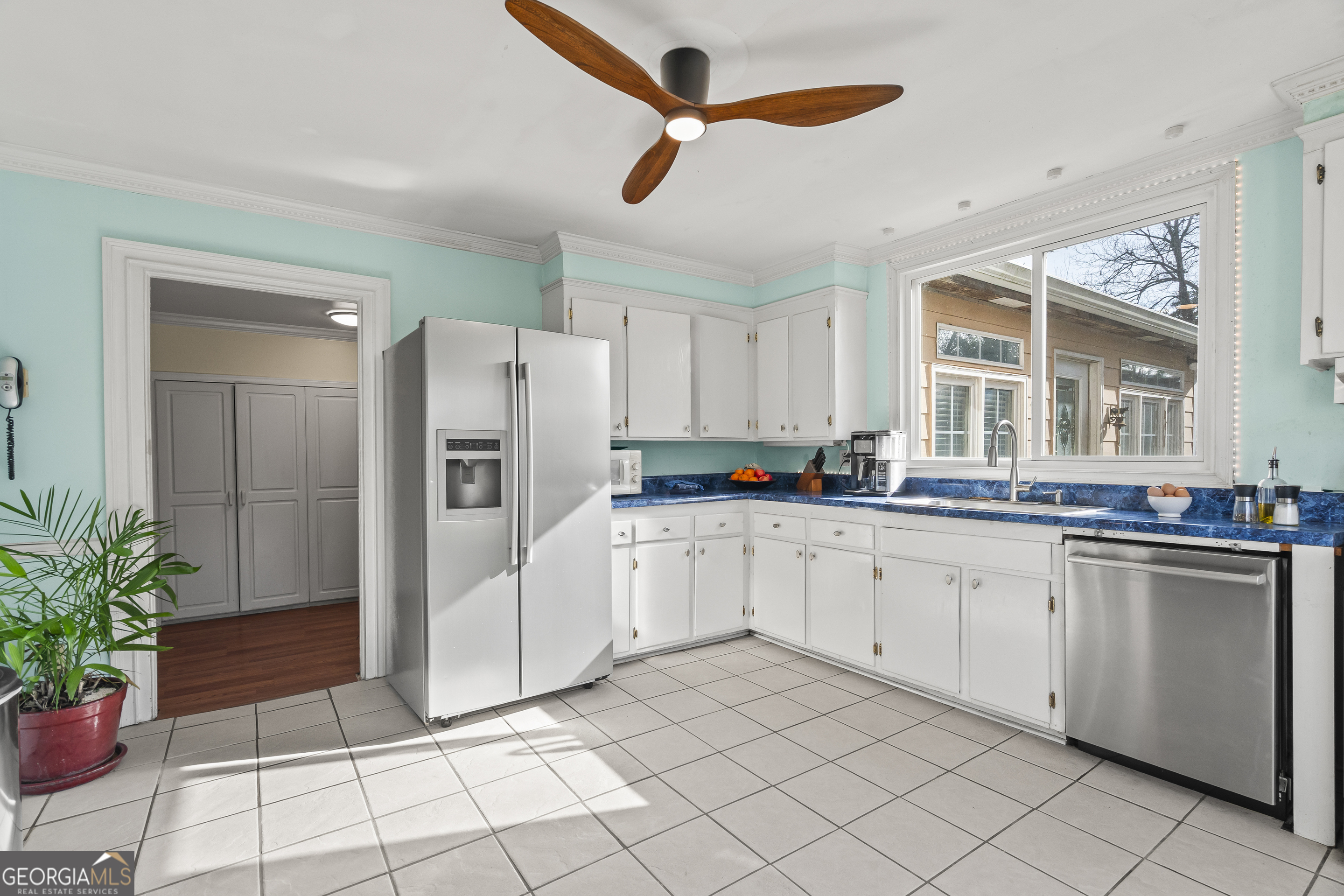 48 Georgia Avenue Comer, GA 30629 - Photo 4 of 46 a kitchen with white cabinets and white appliances