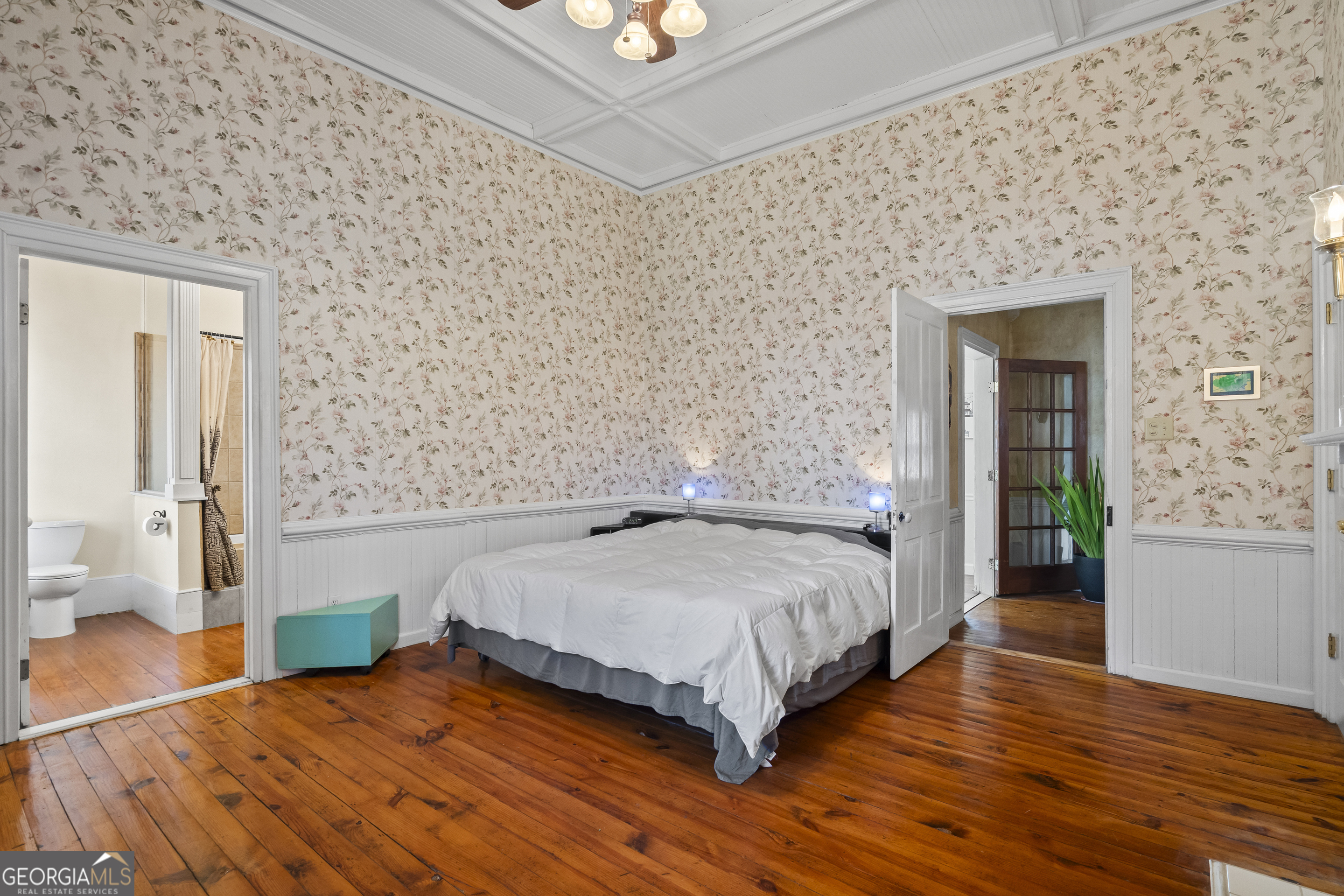 48 Georgia Avenue Comer, GA 30629 - Photo 5 of 46 a bedroom with a bed and dresser with wooden floor