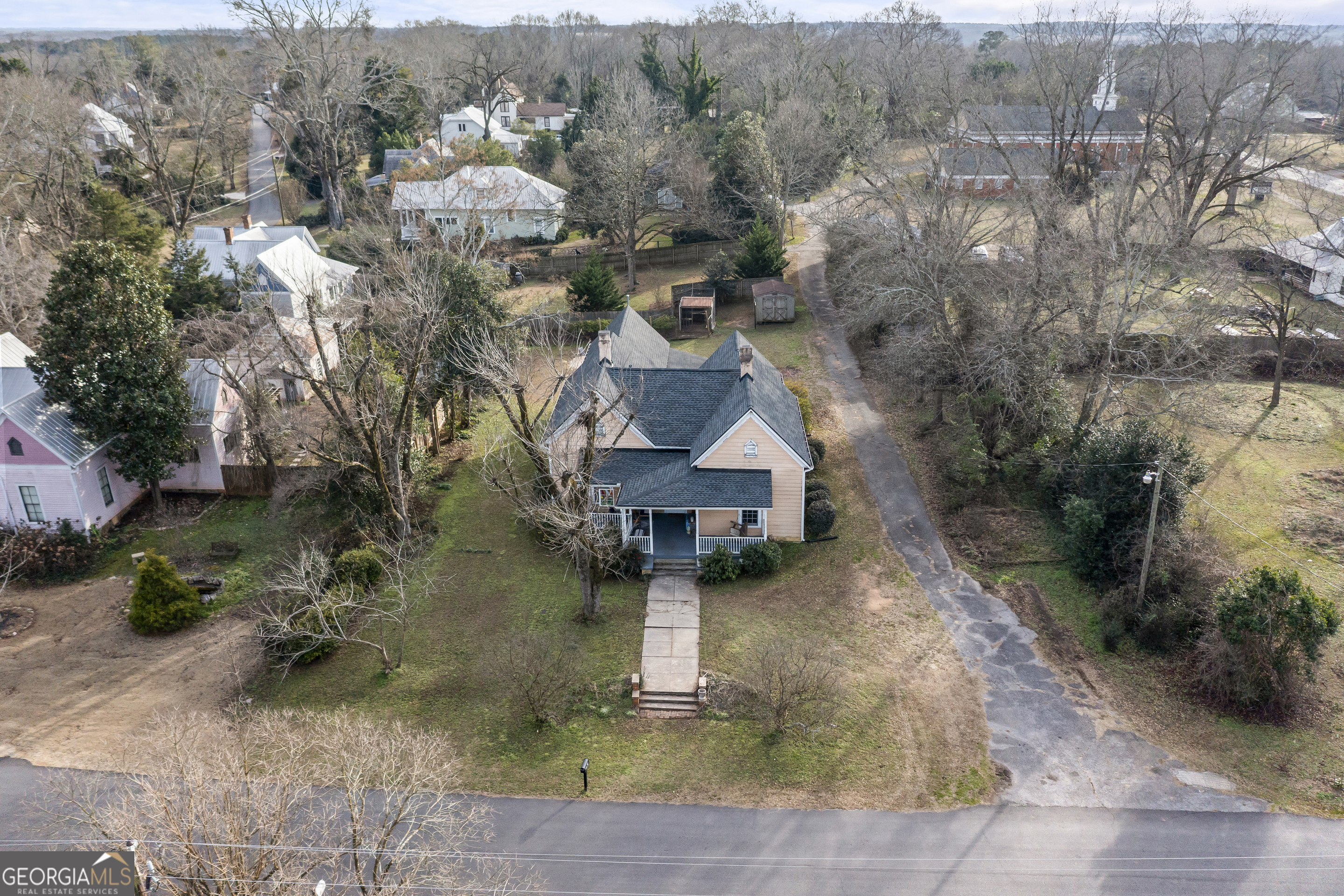 48 Georgia Avenue Comer, GA 30629 - Photo 9 of 46 an aerial view of a house with a yard and large tree