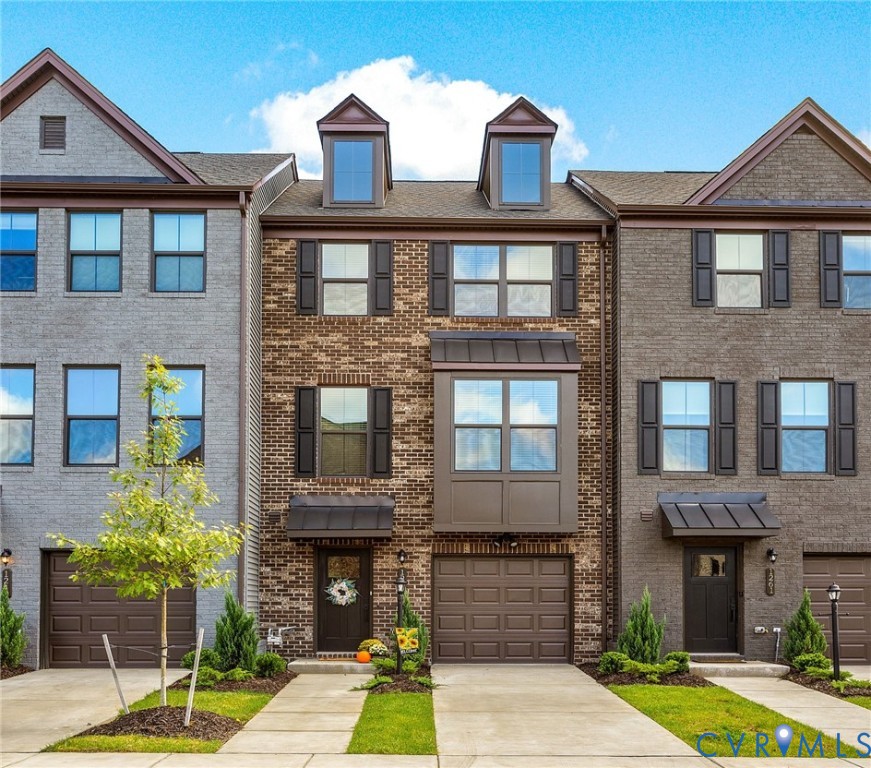 1255 Lazy River Road Midlothian, VA 23114 - Photo 2 of 17 a front view of a building with a garden