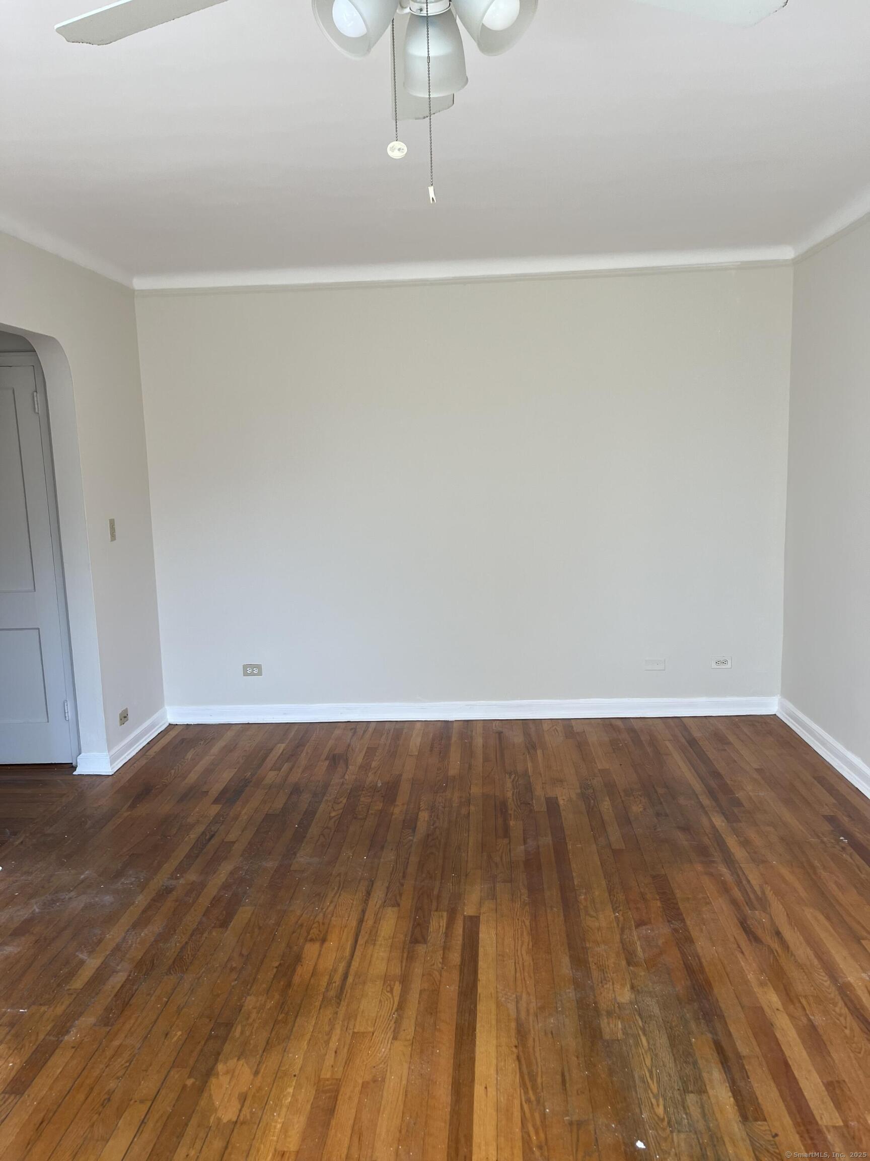 151 View Street Meriden, CT 06450 - Photo 3 of 4 a view of a room with wooden floor and white walls