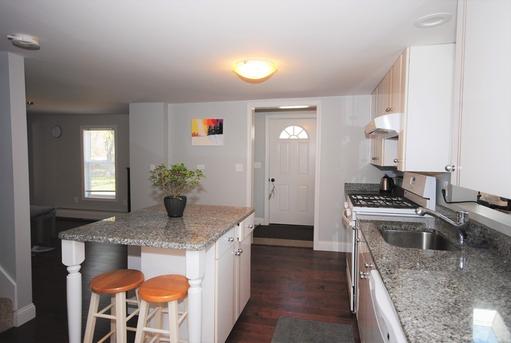 44 Marble Road Sutton, MA 01590 - Photo 6 of 30 a kitchen with stainless steel appliances granite countertop a sink stove and refrigerator