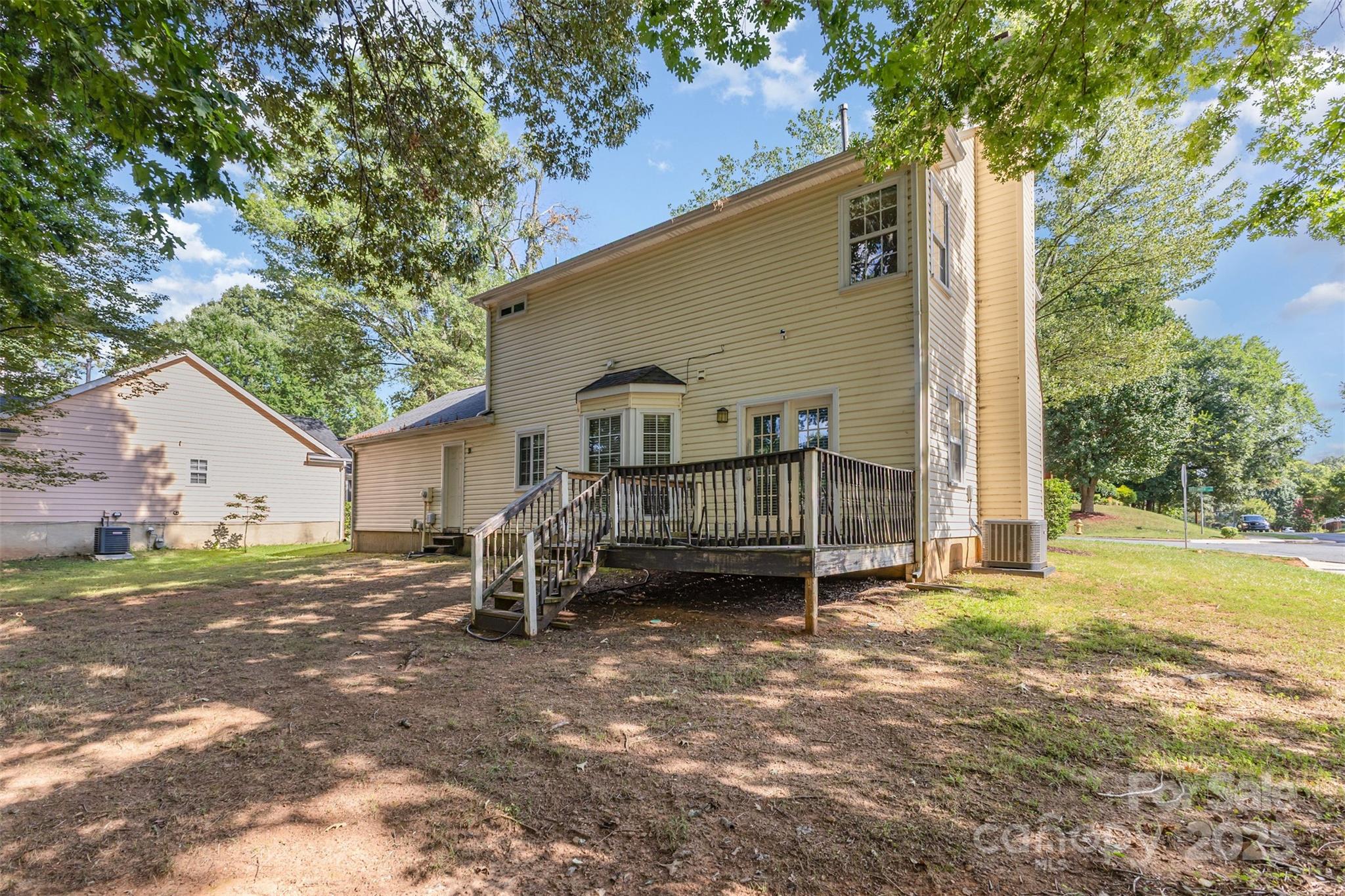2801 Dellinger Drive Charlotte, NC 28269 - Photo 22 of 24 a view of a house with backyard and a tree