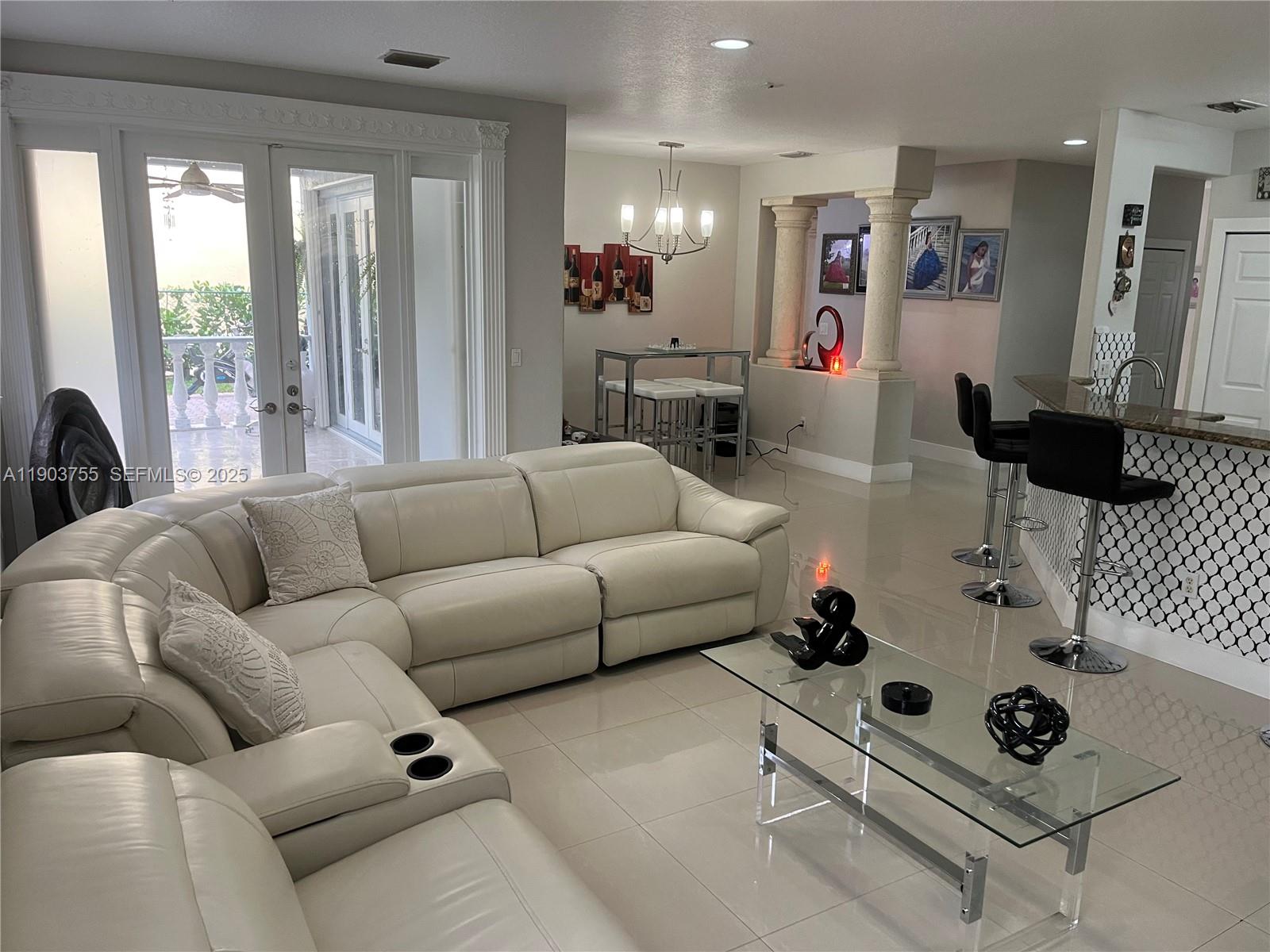 16801 Southwest 38th Street Miramar, FL 33027 - Photo 12 of 63 a living room with furniture and wooden floor