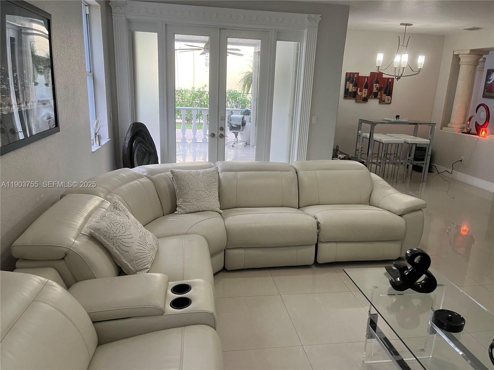 16801 Southwest 38th Street Miramar, FL 33027 - Photo 15 of 63 a living room with furniture and a large window