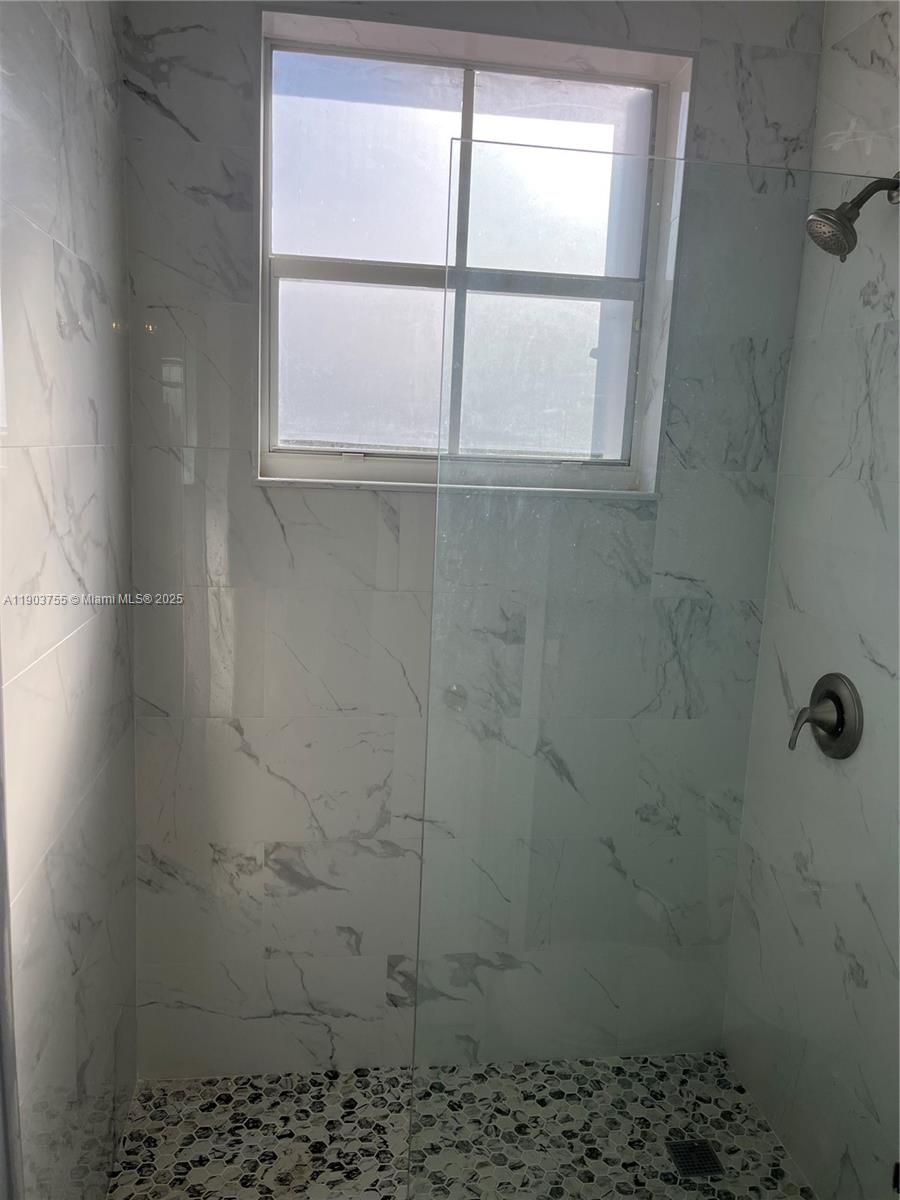 16801 Southwest 38th Street Miramar, FL 33027 - Photo 33 of 63 a bathroom with a window