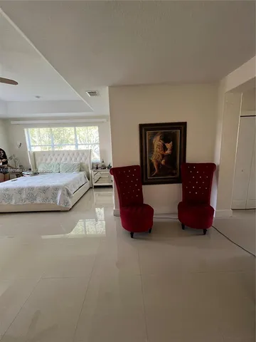 a en suite bathroom with a tub sink and mirror