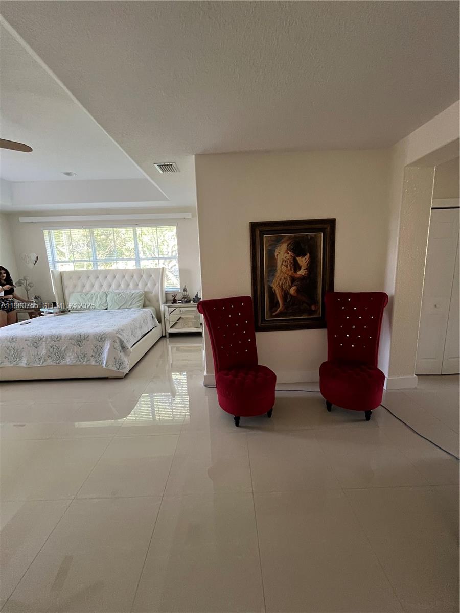 16801 Southwest 38th Street Miramar, FL 33027 - Photo 41 of 63 a living room with furniture and a large window