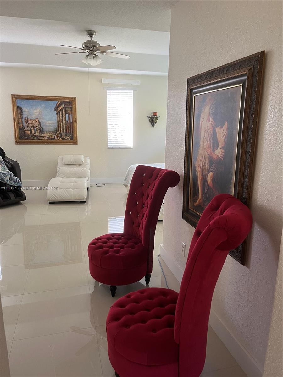 16801 Southwest 38th Street Miramar, FL 33027 - Photo 42 of 63 a living room with furniture and a window