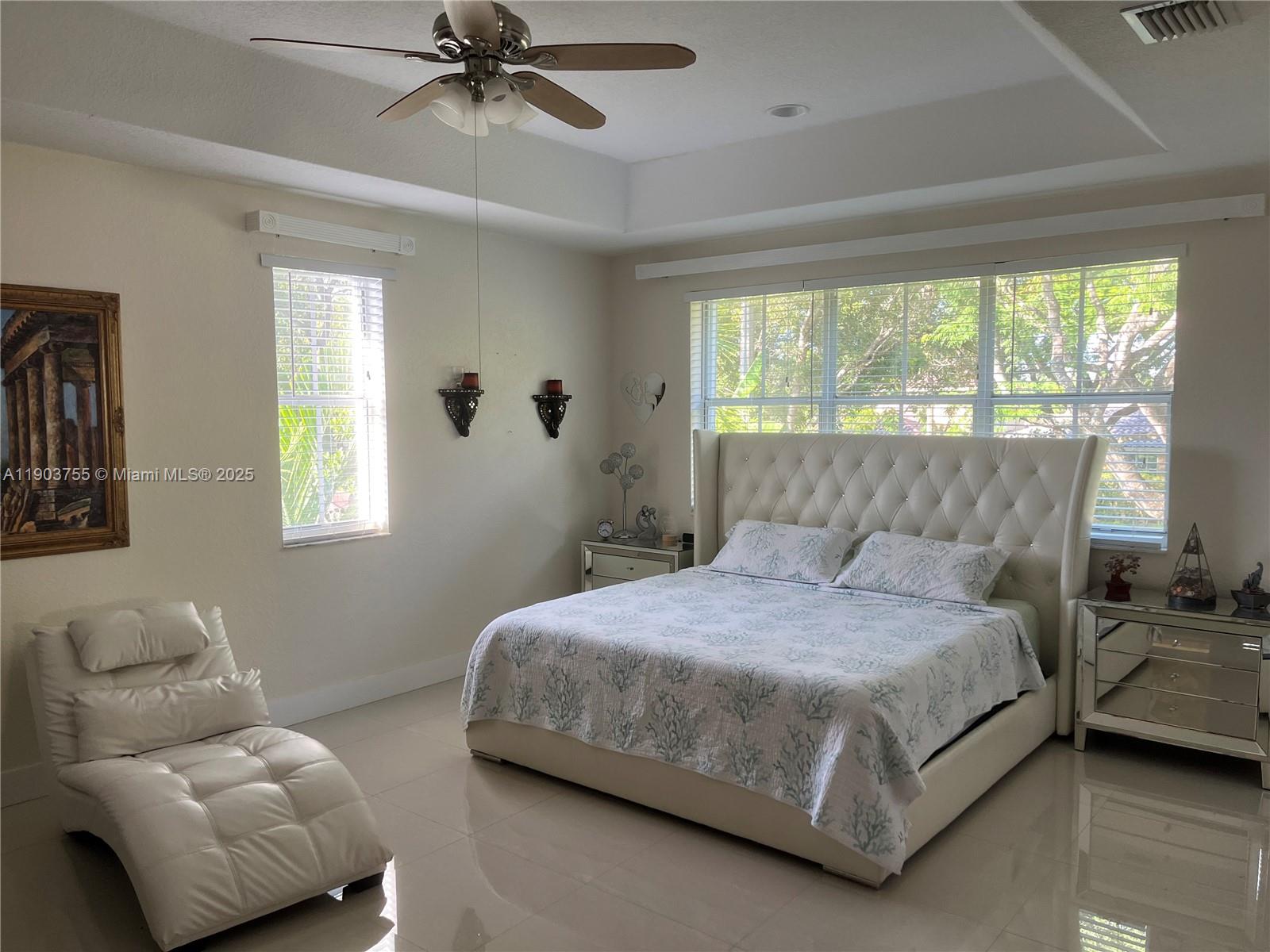 16801 Southwest 38th Street Miramar, FL 33027 - Photo 43 of 63 a bedroom with a bed couch and window