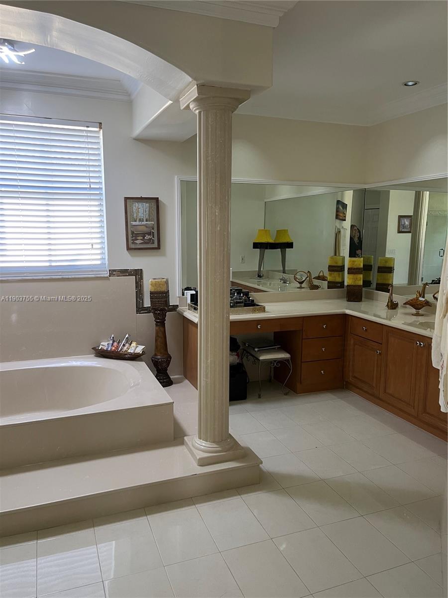 16801 Southwest 38th Street Miramar, FL 33027 - Photo 49 of 63 a en suite bathroom with a tub sink and mirror