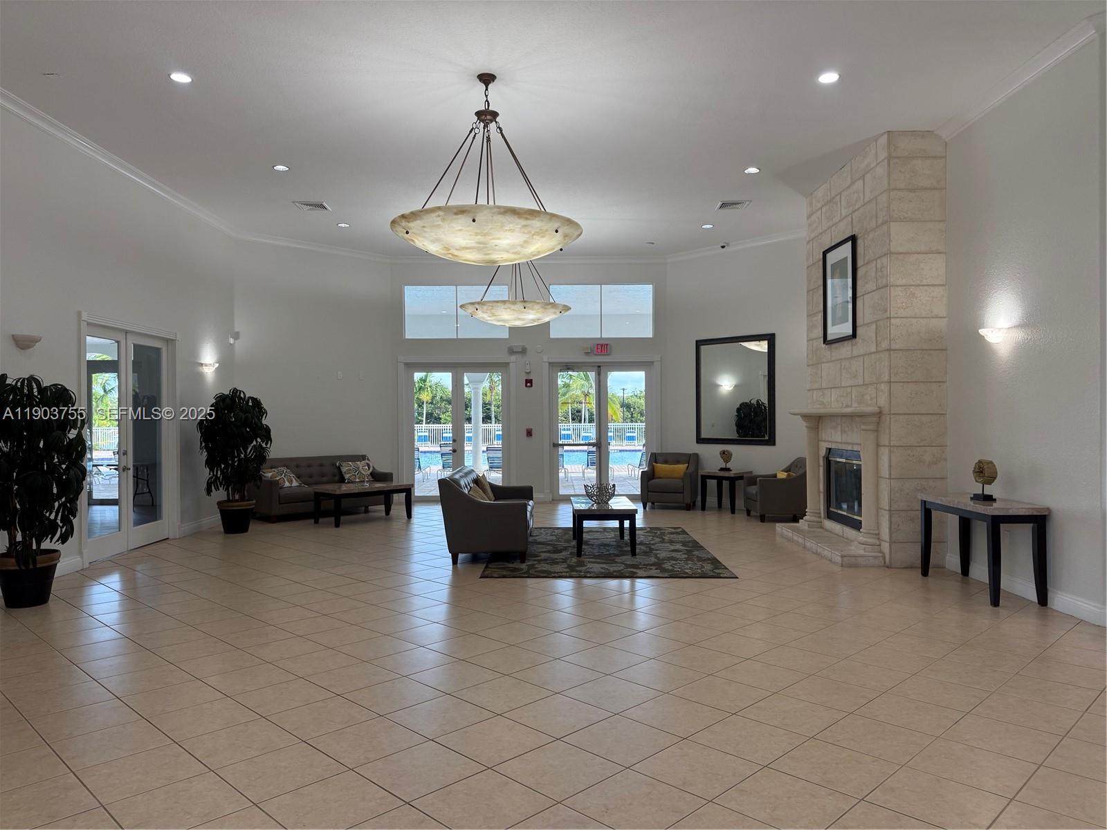 16801 Southwest 38th Street Miramar, FL 33027 - Photo 58 of 63 a view of a livingroom with furniture chandelier and a large window