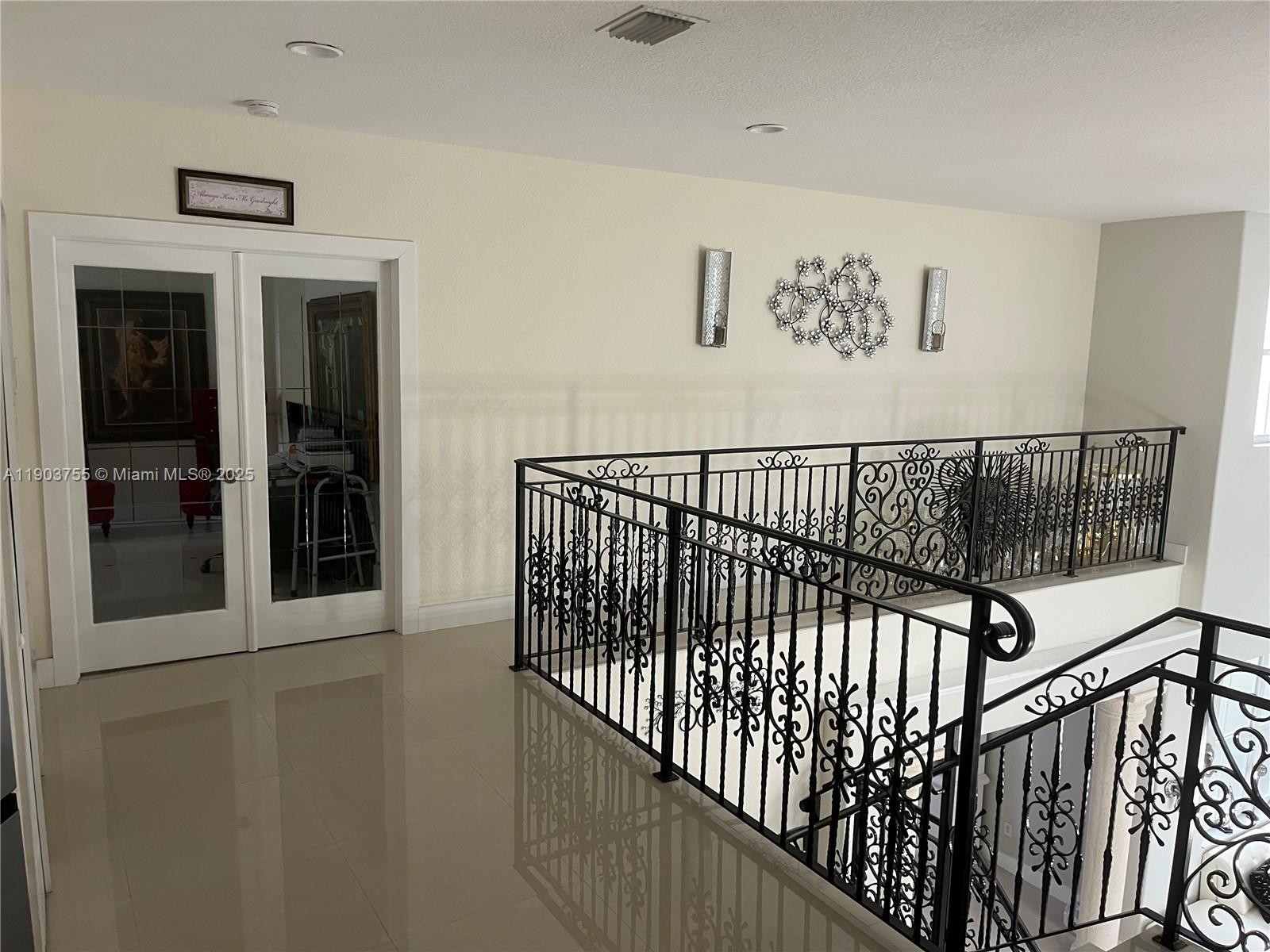 16801 Southwest 38th Street Miramar, FL 33027 - Photo 10 of 63 a view of a hallway with wooden floor and windows