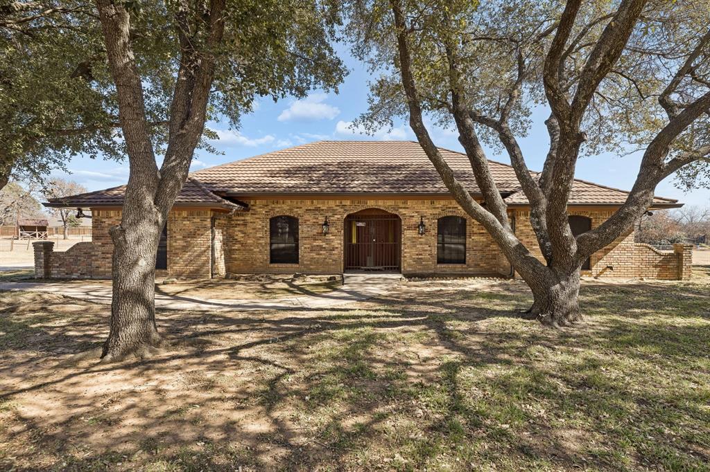 Ranch-style home with brick siding