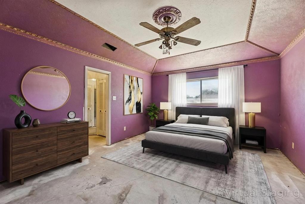 241 Simmons Road Double Oak, TX 75077 - Photo 24 of 40 Bedroom with a textured ceiling, ceiling fan, and a tray ceiling