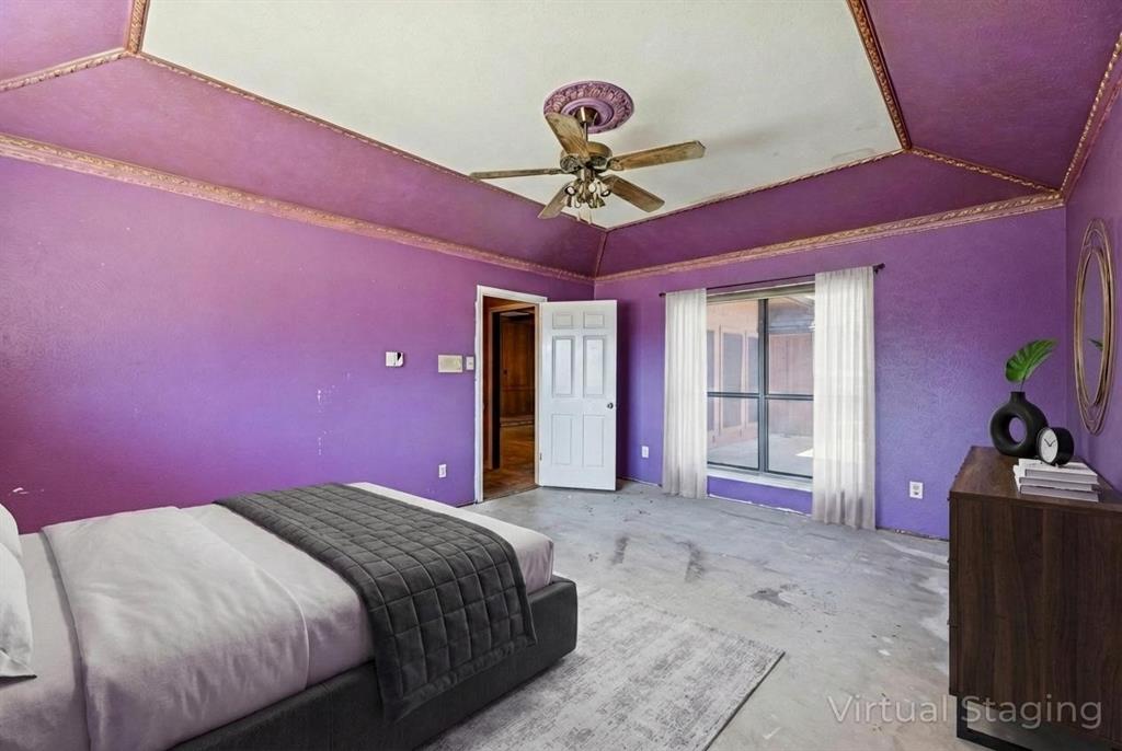 241 Simmons Road Double Oak, TX 75077 - Photo 26 of 40 Bedroom with a raised ceiling and ceiling fan