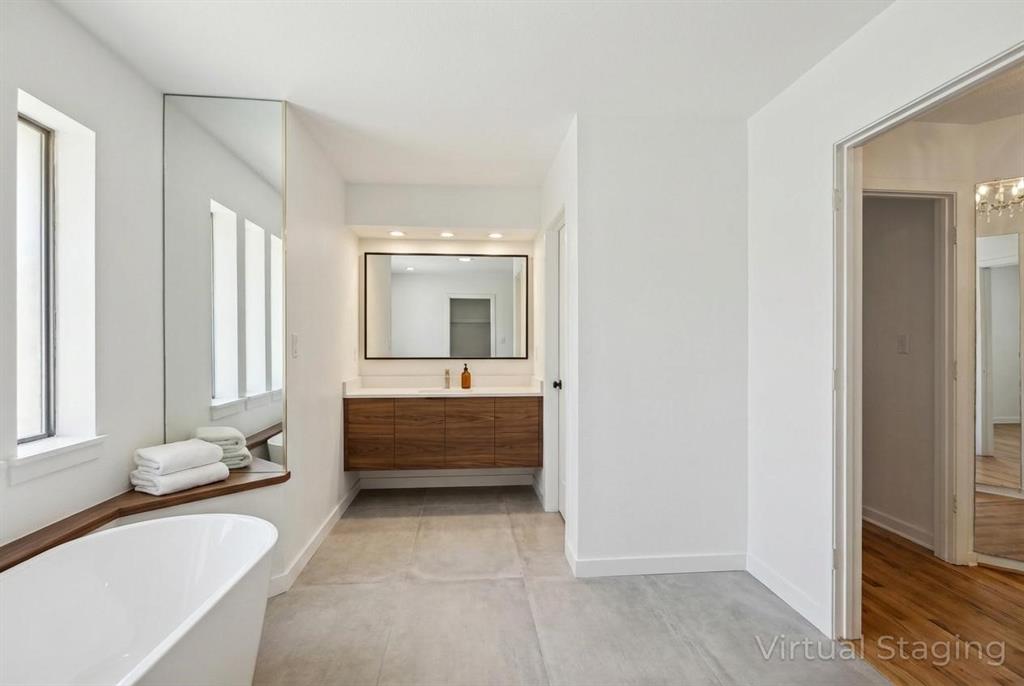 241 Simmons Road Double Oak, TX 75077 - Photo 30 of 40 Bathroom with vanity and a freestanding tub