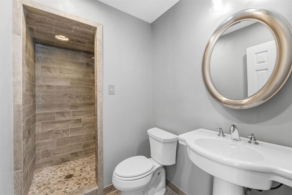 241 Simmons Road Double Oak, TX 75077 - Photo 34 of 40 Full bathroom featuring a stall shower and recessed lighting