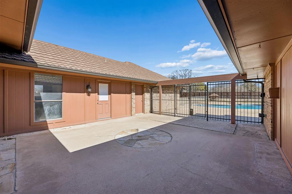 241 Simmons Road Double Oak, TX 75077 - Photo 35 of 40 View of patio featuring a community pool